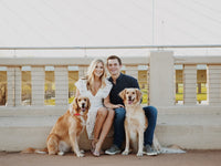 Marcus and Becca Gibson the founders of W.M. Gibson with their golden retrievers.
